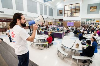 Marcus Larson/News-Register##
During lunch on the Day Without Hate, Duniway students sit and talk with people they had never met before. Teacher Brent Cartier uses a megaphone to offer conversation starters at each table.