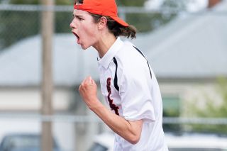 Marcus Larson/News-Register##
McMinnville’s Silas Sumner pumps his fist after scoring a point in his close singles match last Thursday against Newberg.