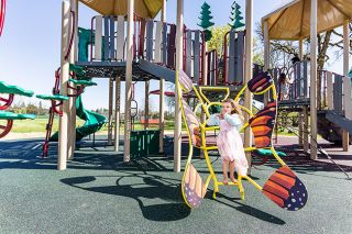 Marcus Larson/News-Register##Faye Westendorf, 4 1/2, tries out the butterfly ladder at the new Wennerberg Park playground, which also features slides, a bridge and other areas meant to appeal to youngsters. “It’s good!” Faye said. Grants paid for the play equipment. Marcus Larson/News-Register##Faye Westendorf, 4 1/2, tries out the butterfly ladder at the new Wennerberg Park playground, which also features slides, a bridge and other areas meant to appeal to youngsters. “It’s good!” Faye said. Grants paid for the play equipment.