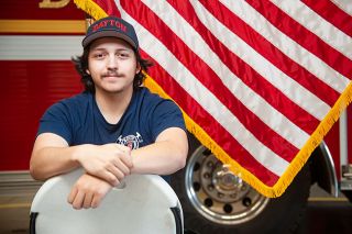 Rusty Rae/News-Register ##
Dayton firefighter Harlyn Rios climbed a ladder steadied by Lt. Jeremy McLoud and retrieved the U.S. and state of Oregon flags on the Organic Valley Creamery property during the April 27 three-alarm fire. Rusty Rae/News-Register ##
Dayton firefighter Harlyn Rios climbed a ladder steadied by Lt. Jeremy McLoud and retrieved the U.S. and state of Oregon flags on the Organic Valley Creamery property during the April 27 three-alarm fire.