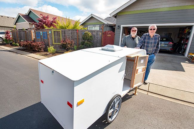 Rusty Rae/News-Register##In an effort to help people without homes, Patrick Evans and Lee Eggers designed and are building small trailers that can be pulled behind bicycles.