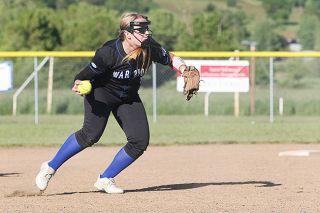 Rockne Roll/News-Register ##
Amity freshman Callee Roberts prepares to throw to first base during the Class 3A Warriors’ 13-12 victory over Class 2A/1A Regis on Tuesday.
