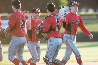 Marcus Larson/News-Register ##
McMinnville baseball players congratulate one another following their 3-2 victory over North Salem Tuesday evening.