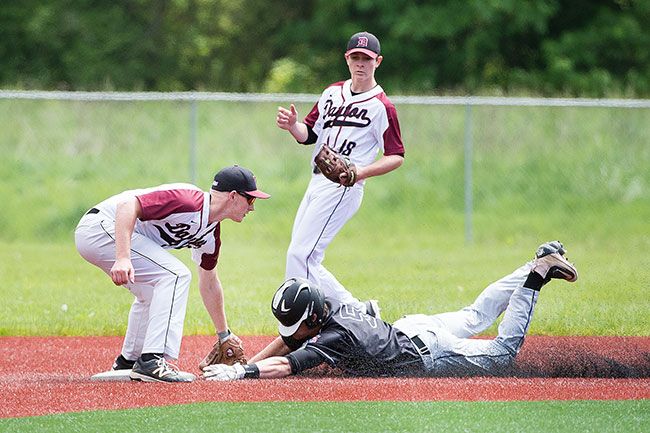 Marcus Larson/News-Register##
Dayton s Jacob deSmet puts the tag down for the out on a Sisters runner attempting the steal.