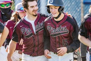 Marcus Larson/News-Register##
Dayton&rsquo;s Kaden Fergus (left) congratulates Dylan Yates (13) after he hit the first home run of his young career in Friday&rsquo;s away game against Amity.