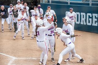 Rusty Rae/News-Register##
Linfield&rsquo;s softball team celebrates Jenny Ball&rsquo;s (21) grand slam in the first inning of Saturday&rsquo;s NWC Tournament championship game. The Wildcats eventually prevailed 9-1 to clinch a berth in the NCAA playoffs.