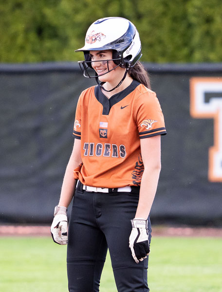 Marcus Larson/News-Register##
Yamhill-Carlton junior Lexiss Antle flashes a smile toward her teammates in the dugout after hitting her second double against Amity during Tuesday’s league matchup.