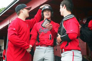 Rockne Roll/News-Register##
McMinnville baseball coach Jordan Harlow (left) congratulates Grizzlies senior David Brosius (1) as sophomore Wyatt Smith (right) looks on during McMinnville’s 4-0 victory over McNary Wednesday afternoon at the McMinnville baseball field at Patton Middle School.
