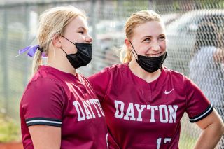 Marcus Larson/News-Register##
Dayton’s Maddie Fluke (left) and Jodi deSmet reflect on their team’s 9-0 win over Harrisburg/Mohawk during last Thursday’s non-league game.