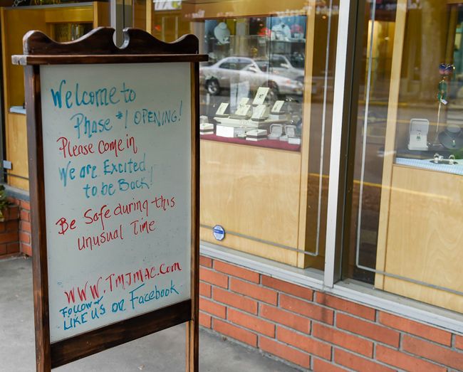 Rusty Rae/News-Register##
A sign outside Timmereck and McNicol welcomes shoppers to the store.