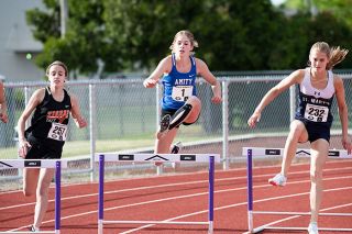 Rusty Rae/News-Register##
Amity sophomore Olivia Farrior clears a hurdle during the girls 300m hurdles final at the Class 3A Culmination Championship Meet held at Harrisburg High School. Farrior won her event with a personal record of 48.14 seconds