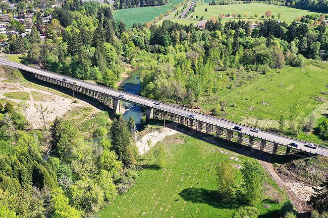 File photo##Crews have opened the replacement bridge next to the 1950s Three Mile Lane bridge in McMinnville. The old span will be torn down and replaced.