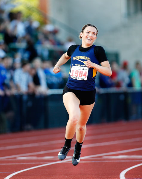 Rockne Roll/News-Register##
Sheridan’s Ronni VanZant smiles as she sees her winning time in the final of the 3A Girls 100-Meter Dash at  the 2018 Track and Field Championships May 18 at Hayward Field.