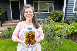 Marcus Larson News-Register ## Beth Moline shows one way she uses the fruit of her favorite plant, the pineapple guava. She cuts the ripe fruit into chunks and lets it steep in gin.