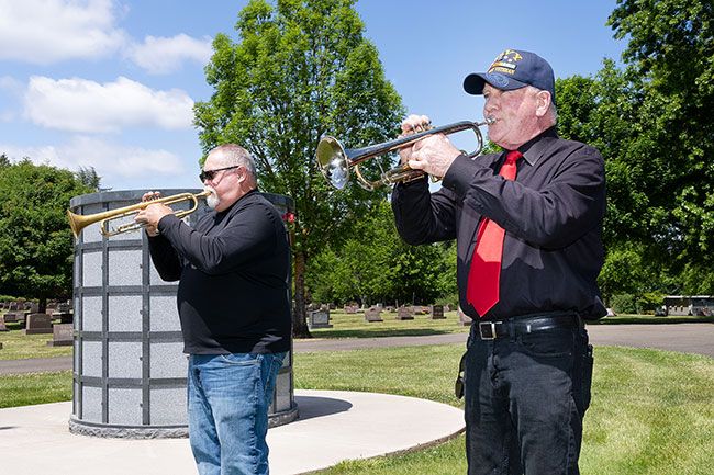 Marcus Larson/News-Register ##
Trumpeters Mark Williams and Brian Shirley practice “Taps” at the Evergreen Memorial Cemetery. They will be playing at Evergreen and several other cemeteries this weekend in honor of people who gave their lives in service to the country.