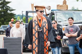 Marcus Larson/News-Register##Nakoa Mercier is surrounded by family at his Willamina High School graduation.