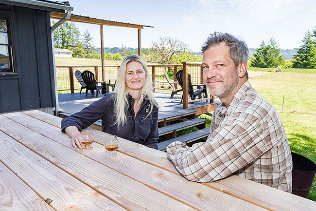 Marcus Larson/News-Register##
Kate Coulter and Colin Fisher of Killdeer Distilling take a moment to rest on the deck of their tasting room in the Ribbon Ridge hills northeast of Carlton and Yamhill.