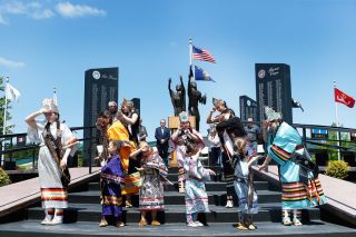 Rockne Roll/News-Register##
Tribal court members perform  The Lord s Prayer  during the Confederated Tribes of Grand Ronde s Memorial Day Observance Monday, May 28 at the West Valley Veterans Memorial in Grand Ronde.
