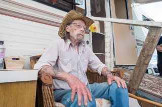 Marcus Larson/News-Register##Sleepy Hollow RV Park resident James Nelson sits outside the RV he is currently staying in after having to move out of his own trailer because it was inhabitable. Nelson is on hospice care.