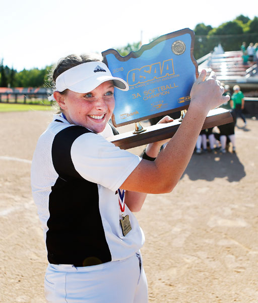 Rockne Roll/News-Register##
Dayton’s Catie Jacks celebrates with the OSAA Class 3A Softball State Championship trophy following the Pirates’ 3-2 victory over the Rainier Columbians June 1 at Oregon State University in Corvallis.