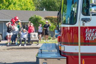 Rusty Ray/News-Register##Retired teacher and longtime fire volunteer Dan Belderrain, seated, and his family wave to firefighters and police officers who escorted Belderrain to McMinnville from a Portland hospital June 1. He spent his final week at home before dying Saturday, June 6. Rusty Ray/News-Register##Retired teacher and longtime fire volunteer Dan Belderrain, seated, and his family wave to firefighters and police officers who escorted Belderrain to McMinnville from a Portland hospital June 1. He spent his final week at home before dying Saturday, June 6.