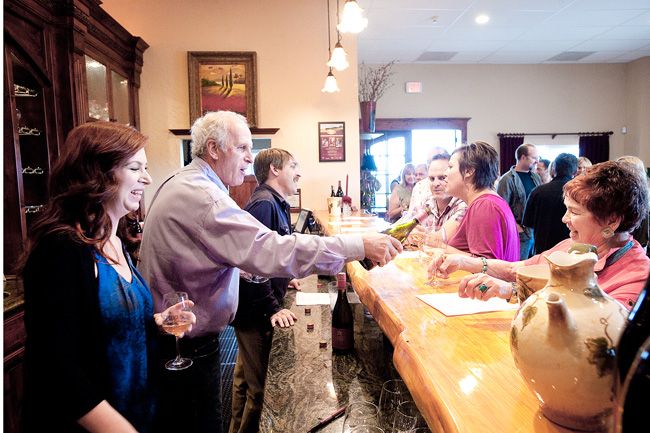 News-Register file photo##Allen Methven pours wine for guests during an hors d’oeuvres reception in the Methven Family Vineyards tasting room in 2012. Methven died Monday, March 14.