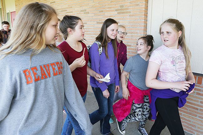 Rockne Roll/News-Register##Kaylee and her classmates head to drama class. She keeps a small backpack with her at all times. It contains the sixth-grader’s blood glucose meter and other diabetic testing supplies, her insulin auto-injector and a supply of high-sugar snacks, such as fruit juice and candy.