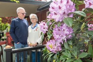 Rusty Rae News-Register ## Mark and Susan Gorrie enjoy growing all sorts
of flowers, from rhododendrons to roses. Their shaded back yard also includes a fish pond.
