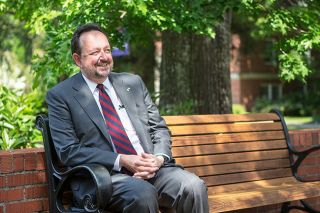 Rockne Roll/News-Register##
Linfield College President Thomas Hellie enjoys a sunny day on campus. He ll be moving to Portland after he retires June 30.