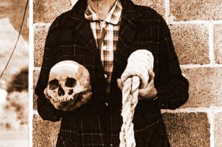 Ben Maxwell/ Salem Public Library##Howard A. Black, curator at Grant County Museum in Canyon City, Oregon, holds the skull of Berry Way and a “California collar,” or noose, of the type Way was hanged with, in this 1963 photograph.