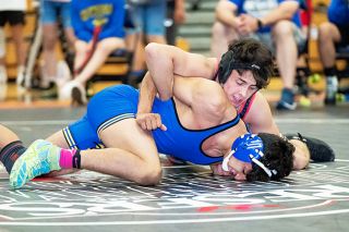 Marcus Larson/News-Register##
McMinnville’s Dominik Miller takes his opponent to the mat during Friday’s quad-duals at Liberty High School. Miller finished second in the 152-pound division. Marcus Larson/News-Register##
McMinnville’s Dominik Miller takes his opponent to the mat during Friday’s quad-duals at Liberty High School. Miller finished second in the 152-pound division.
