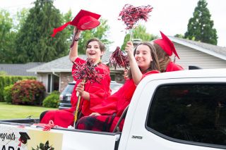 News-Register file photo#Twin sisters Laura and Mary Denney and exchange student Sara Garcia Lacueva wave during the Mac High 2020 graduation parade. News-Register file photo#Twin sisters Laura and Mary Denney and exchange student Sara Garcia Lacueva wave during the Mac High 2020 graduation parade.