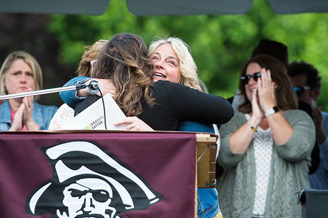 Marcus Larson/News-Register##
Dayton High School Principal Jami Fluke receives a hug from Sherri
Sinicki before giving her speech to the graduating class of 2019.
Sinicki introduced the principal, who is leaving to take another job, in
glowing terms.