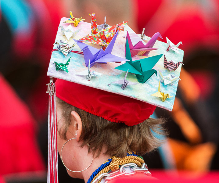 Marcus Larson / News-Register##Graduating senior Delanie Crabtree adorns her mortarboard with origami cranes for McMinnville High School s Friday night graduation.