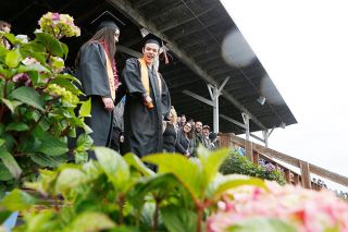 Rockne Roll/News-Register##Students process to their seats during commencement exercises for the Yamhill-Carlton High School Class of 2018 held Sunday at Laughlin Field in Yamhill.