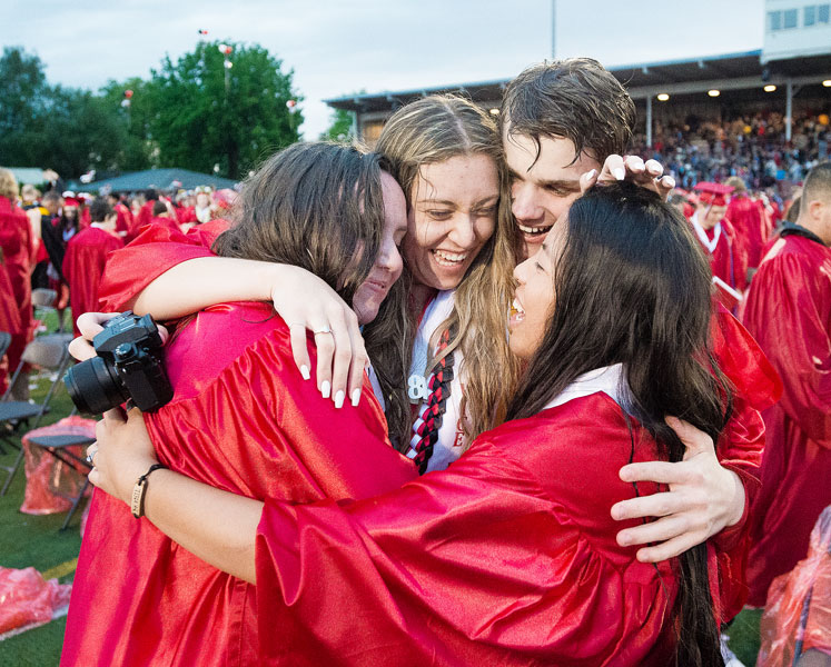 Marcus Larson/News-Register##
McMinnville High School graduates Madeline Gibson, Natalia Rentsch, Caleb Landis and Allison Robertson share a group hug at the conclusion of commencement.