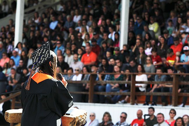 Rockne Roll/News-Register##
Valedictorian Emily Lockhart addresses her classmates and the crowd during the commencement exercises for the Yamhill-Carlton High School Class of 2017, held  Sunday, June 11, at Laughlin Field in Yamhill.