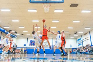 Marcus Larson/News-Register##
Yamhill-Carlton’s Moroni Seely-Roberts (1) shoots a short shot as Amity’s Isaac Watcherson (15) and Logan Grove (3) defend. Seely-Roberts scored 33 points and grabbed a career-high 23 rebounds in the Tigers’ 68-58 victory. Marcus Larson/News-Register##
Yamhill-Carlton’s Moroni Seely-Roberts (1) shoots a short shot as Amity’s Isaac Watcherson (15) and Logan Grove (3) defend. Seely-Roberts scored 33 points and grabbed a career-high 23 rebounds in the Tigers’ 68-58 victory.