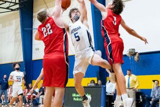 Marcus Larson/News-Register##
Sheridan senior Braden Mendenhall finishes a tough lay-up as he absorbs contact from two Kennedy defenders. Mendenhall had a double-double (15 points, 12 rebounds) in the 69-61 win. Marcus Larson/News-Register##
Sheridan senior Braden Mendenhall finishes a tough lay-up as he absorbs contact from two Kennedy defenders. Mendenhall had a double-double (15 points, 12 rebounds) in the 69-61 win.