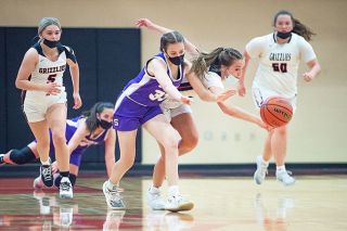 Rusty Rae/News-Register##
McMinnville point guard Laney Hyder pokes the ball away from a Sunset ball-handler during Tuesday’s non-conference contest, which the Grizzlies won, 48-30. Rusty Rae/News-Register##
McMinnville point guard Laney Hyder pokes the ball away from a Sunset ball-handler during Tuesday’s non-conference contest, which the Grizzlies won, 48-30.