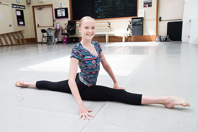Marcus Larson/News-Register##Mia Audova demonstrates her flexibiity by doing the splits. When she started dance training three years ago, the first things she worked on were becoming flexible and building up her core muscles.