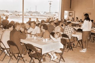 ##(June 7, 1967) Some 350 people attended the Lions Club Fly-In Breakfast and Brunch held at the McMinnville airport Sunday. A special feature of the morning was a community worship service held in a hangar at which time Lions scholarships were presented.