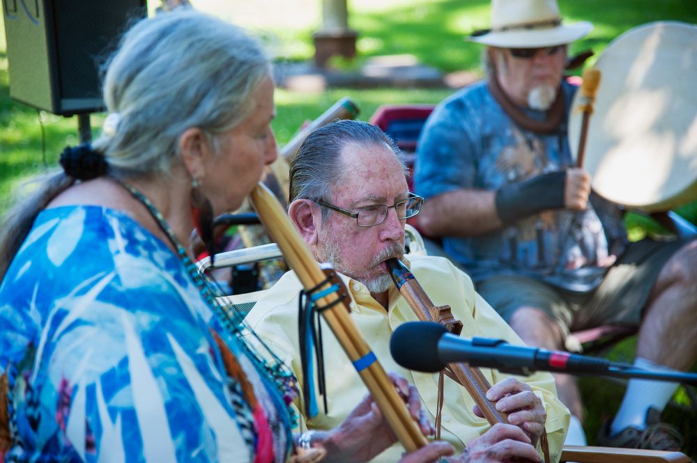 Kirby Neumann-Rea/News-Register##Three Feathers Flute Circle performs indigenous and nature-influenced music Tuesday at McMinnville City Park, employing wind instruments, guitar, cello and drums. Terry Filer performs an original song, accompanied by Malcolm Stephens and George Willingham.