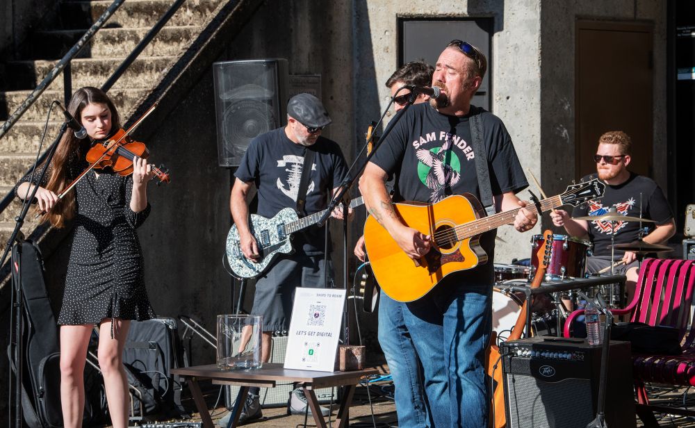 Rusty Rae/News-Register##Ships to Roam rocks the Gallery Theater courtyard on Ford Street, inspiring some in the audience to dance on the sidewalks.
