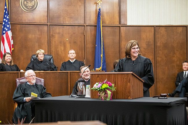 Rusty Rae/News-Register##Yamhill County Circuit Court judges Jennifer Chapman, Cynthia Easterday and Ladd Wiles, in back, join retired judge John Collins and Scappoose Municipal Court Judge Steven Todd for the investiture ceremony.