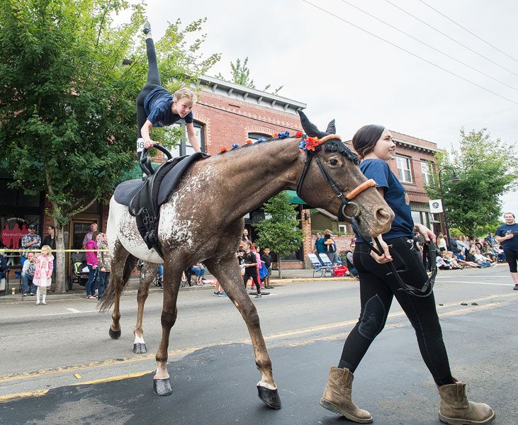 Marcus Larson / News-Registe##r
Kaelee Keller, left,  from Serendipity Vaulting impressed the crowd with
her moves atop a horse led by Francesca Sheld.