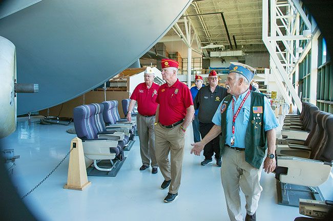 Starla Pointer/News-Register##
Evergreen Aviation Museum docent Terry Naig, right, provides a tour of the Spruce Goose and other exhibits to National American Legion Commander Paul Dillard, center left, and his entourage, including Oregon Commander Don Weber, left, and Oregon national executive committee chair Kevin Owens, center right. Dillard, who’s from Texas, visited the McMinnville, Sheridan and Carlton Legion posts last week to talk about his efforts to “Leave No Veteran Behind.”