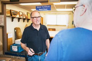 Rusty Rae/News-Register##
Steve Long talks with a customer at the McMinnville Habitat for Humanity ReStore. Long, who is retiring after more than 11 years as manager, said his focus at the ReStore has been bringing in money for Habitat’s projects that provide affordable housing.