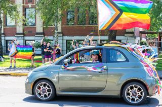 News-Register file photo##The crowd in front of Edwards Elementary School cheers as colorfully decorated cars drive by in last year’s Pride Month car parade in Newberg.