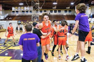 Photo courtesy Mid Major Media##
The Yamhill-Carlton boys basketball team celebrates their 52-48 win over Cascade Christian in the Class 3A state championship held Friday at the Pirate Palace in Coos Bay. Sophomore star Moroni Seely-Roberts (1) led all scorers with 31 points in the title tilt, while twin brother, Malachi (24), scored 19. Photo courtesy Mid Major Media##
The Yamhill-Carlton boys basketball team celebrates their 52-48 win over Cascade Christian in the Class 3A state championship held Friday at the Pirate Palace in Coos Bay. Sophomore star Moroni Seely-Roberts (1) led all scorers with 31 points in the title tilt, while twin brother, Malachi (24), scored 19.